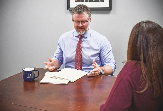 Dihle Tyler with the client